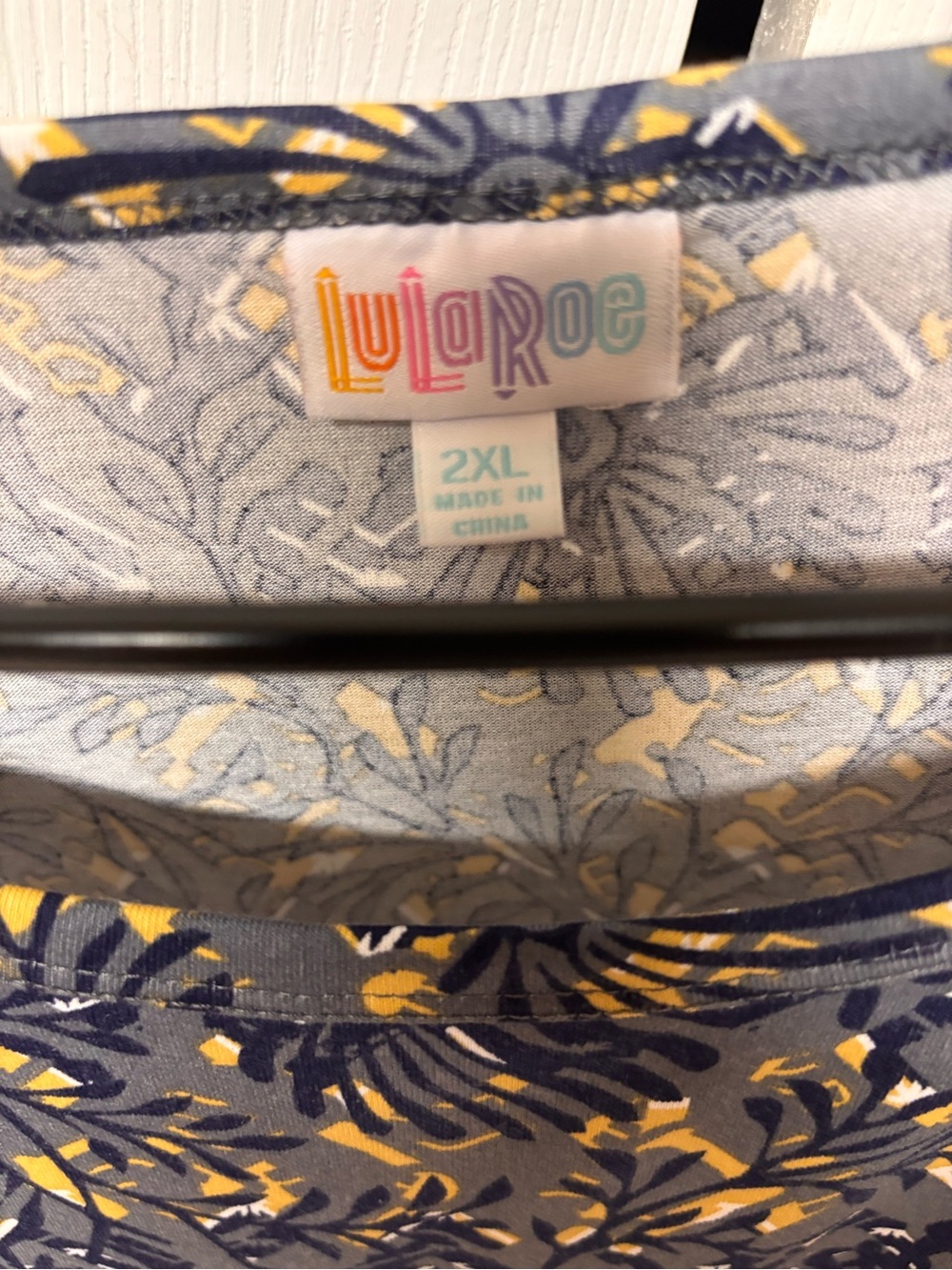 LuLaRoe Short Sleeve Knit Shirt in Black with Teal, Pink & Yellow Accents - Picture 3 of 3
